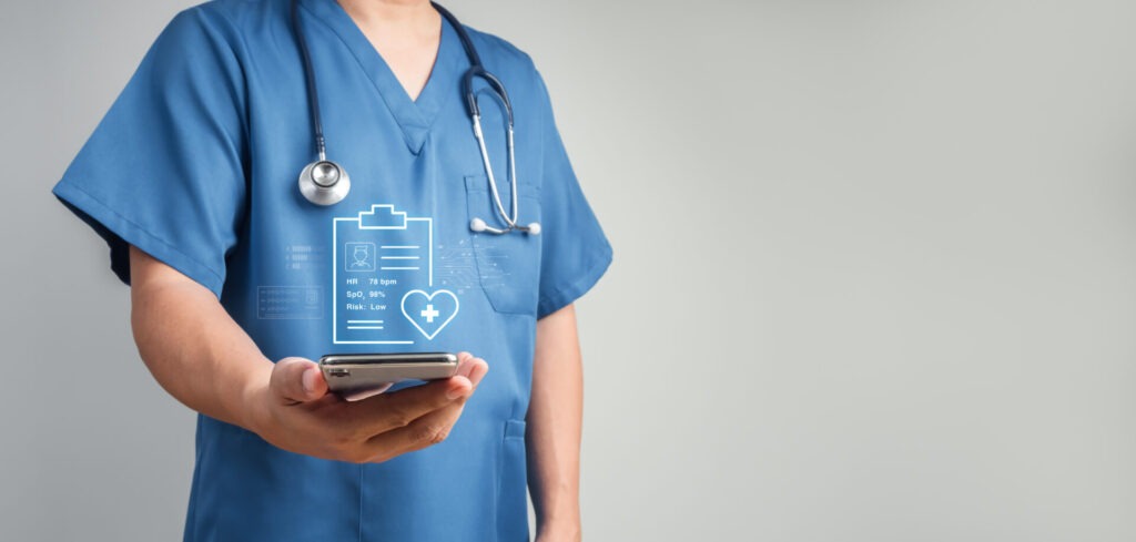 Healthcare Professional Doctor Using Smartphone With Real Time Patient Metrics And Risk Data. Digital Monitoring, Clinical Decision Support, Connected Care And Mobile Health Technology Concepts.